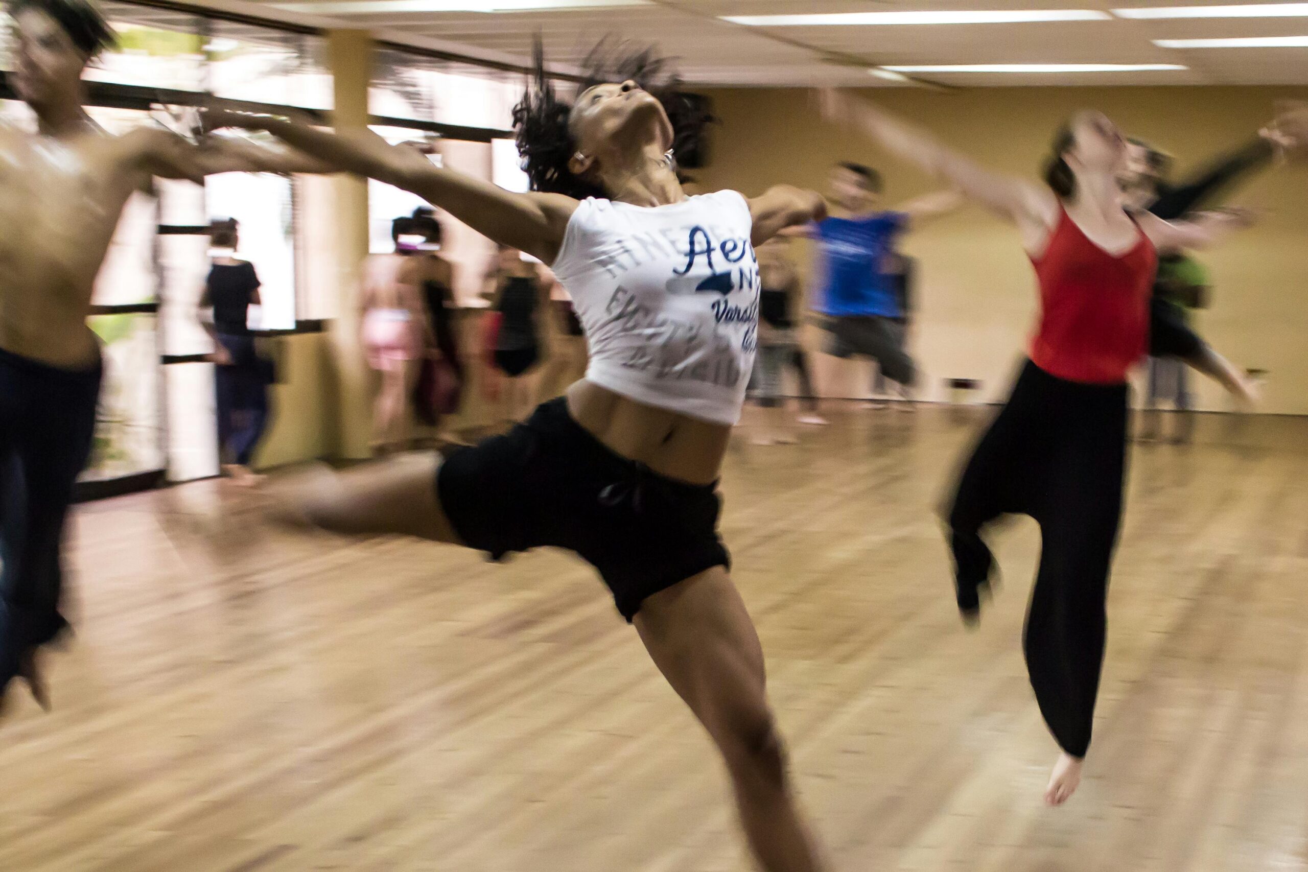 Dynamic group dance class showcasing diverse techniques and spirited expressions.